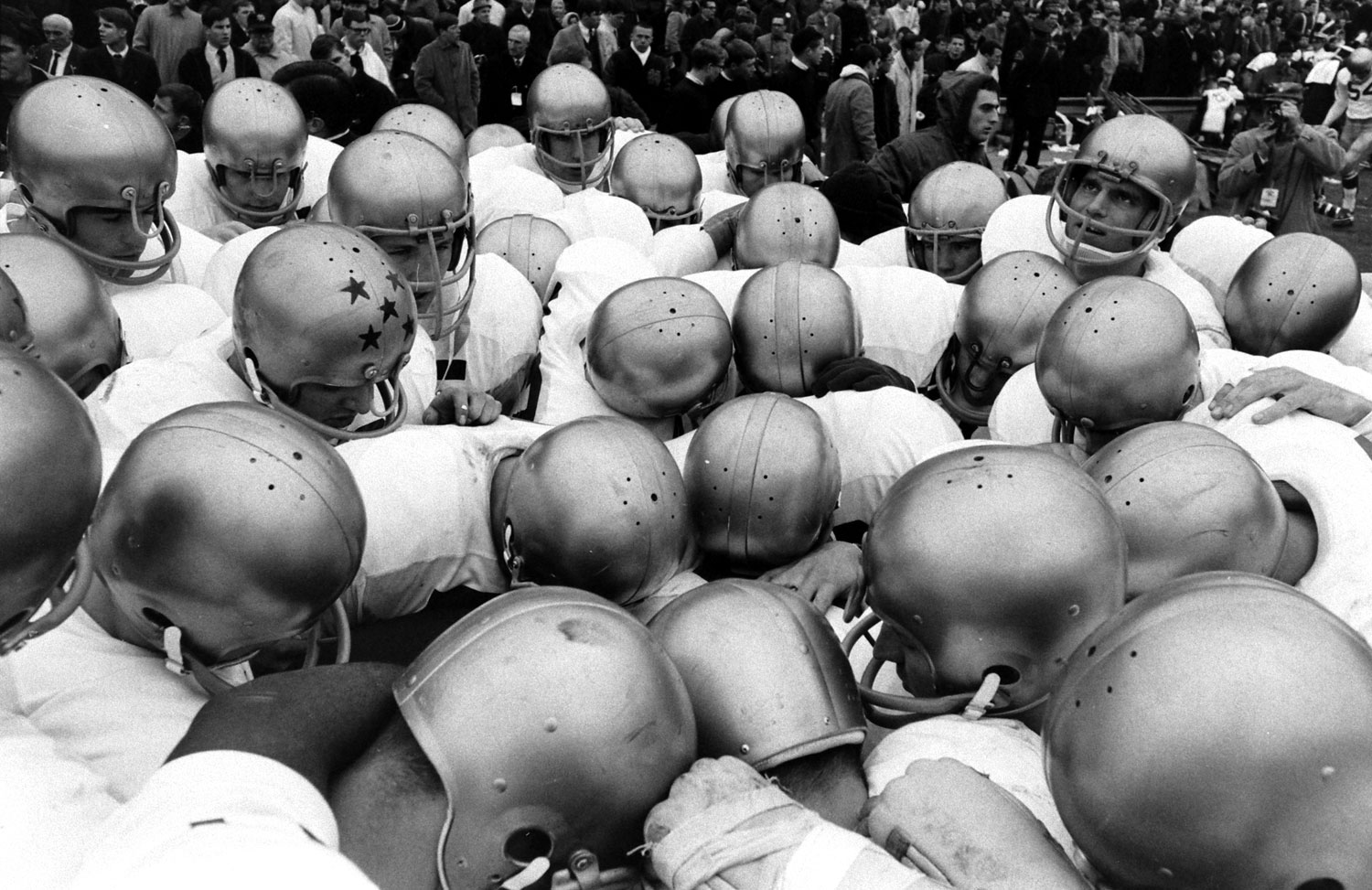 The Fighting Irish huddle before the 1966 "Game of the Century" against Michigan State, November 1966.
