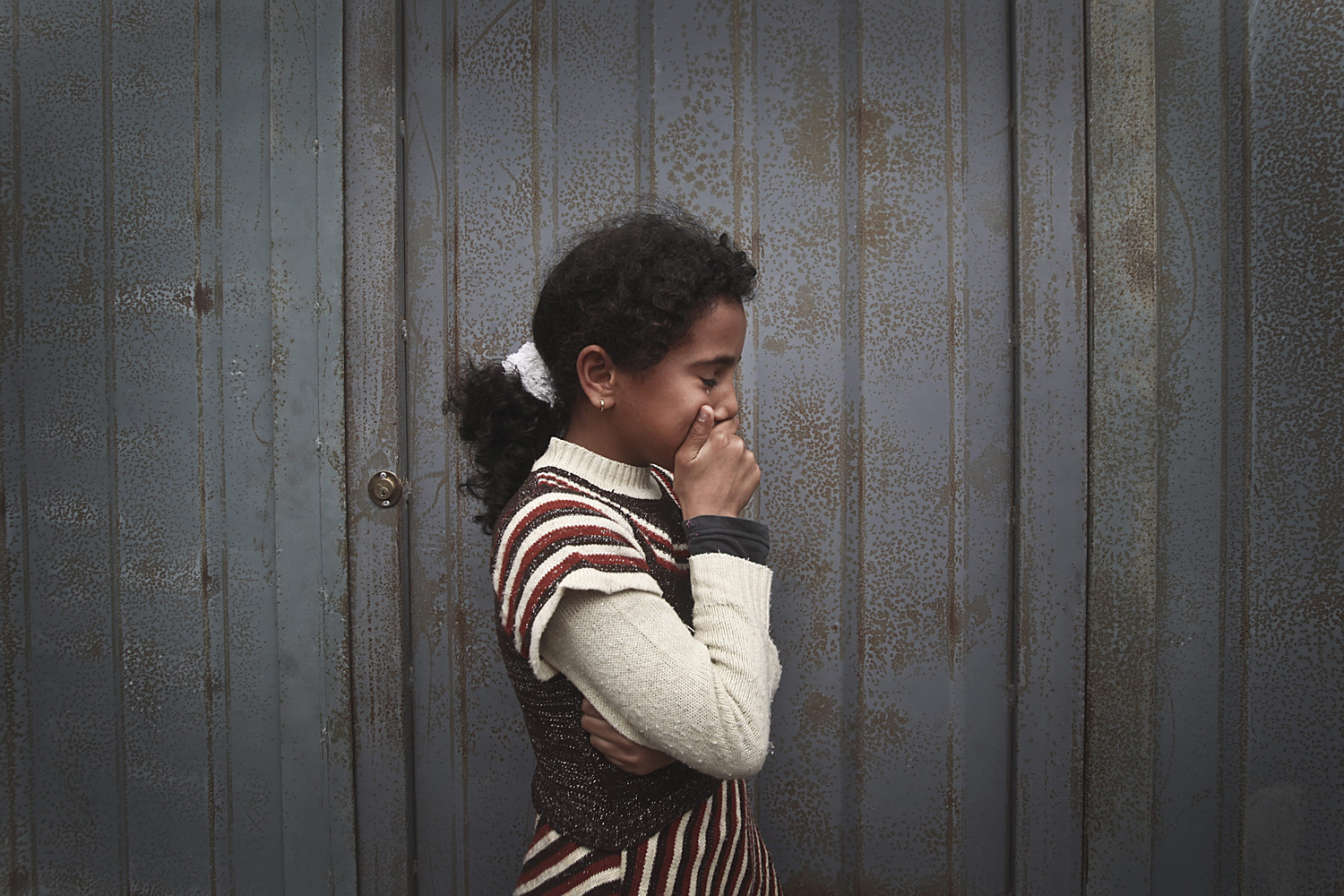 Image: Nov. 9. 2012. The sister of 11-year-old Ahmed Abu Dagah cries during the funeral of her brother in Khan Younis in the southern Gaza Strip.