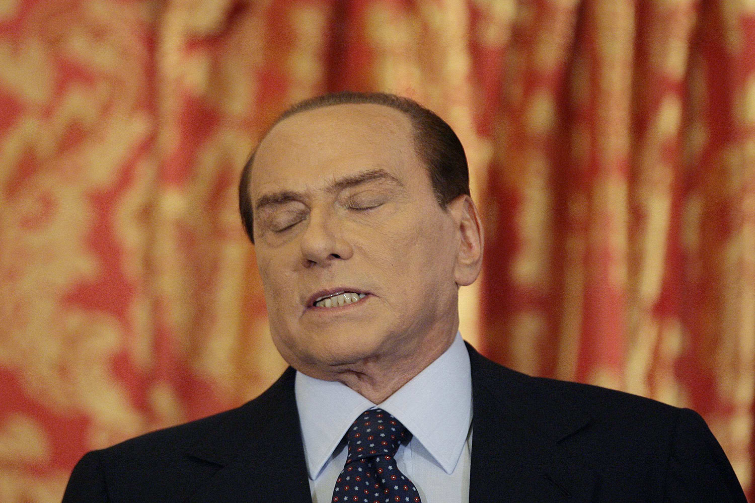 Image: Oct. 27, 2012. Italy's former Prime Minister Silvio Berlusconi speaks during a news conference at Villa Gernetto near Milan. Berlusconi appeared to have done an about-face on Saturday, vowing to stay in front-line Italian politics after a Milan court sentenced him to four years in jail for tax fraud related to his media empire.