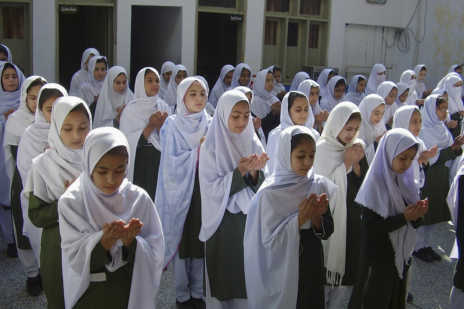 Image: Nov. 10, 2012. Pakistani students pray for the health of 15-year-old Malala Yousufzai during a ceremony at their school in Mingora, Pakistan. Hundreds of Pakistani students and human right activists observed a day of appreciation for Yousufzai, who is being treated in Britain after being shot by the Taliban.