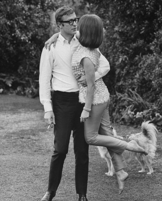 Michael Caine sweeps Natalie Wood off her feet, 1963.