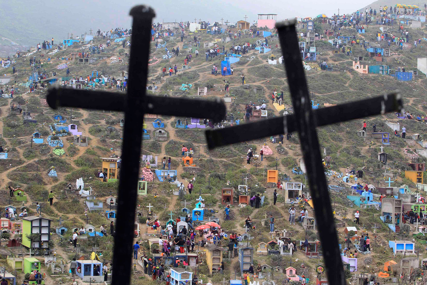 Image: Nov. 1, 2012. A view of Nueva Esperanza cemetery during the Day of the Dead celebrations in Villa Maria, Peru. Each year people visit the cemetery, one of Latin America's largest, to honor the dead.