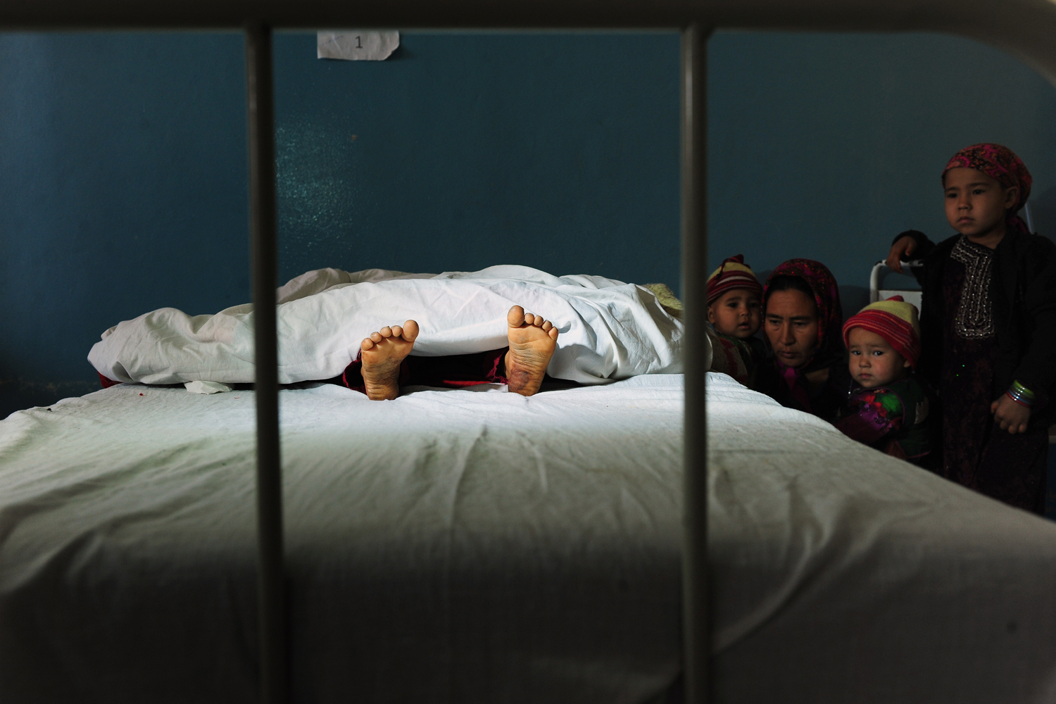 Image: Nov. 12, 2012. The family of a 5-year-old Afghan girl allegedly raped by a 22-year-old man, look on as she lies in a hospital bed in the Kaldar district of Balk Province, Mazar-i-Sharif.