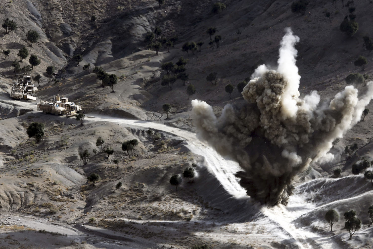 Image: Nov. 4, 2012. U.S soldiers blows up a roadside bomb set up by Taliban fighters near the town of Walli Was in Paktika province, near the border with Pakistan.