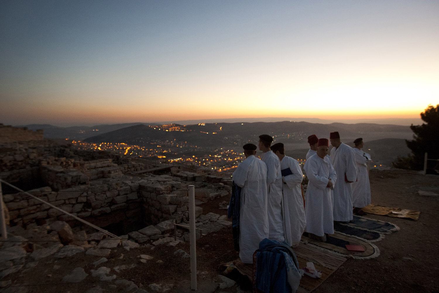 Image: Oct. 29, 2012. Members of the ancient Samaritan community, pray during the pilgrimage for the holy day of the Tabernacles or Sukkot at the religion's holiest site on the top of Mount Gerizim near the West Bank town of Nablus.