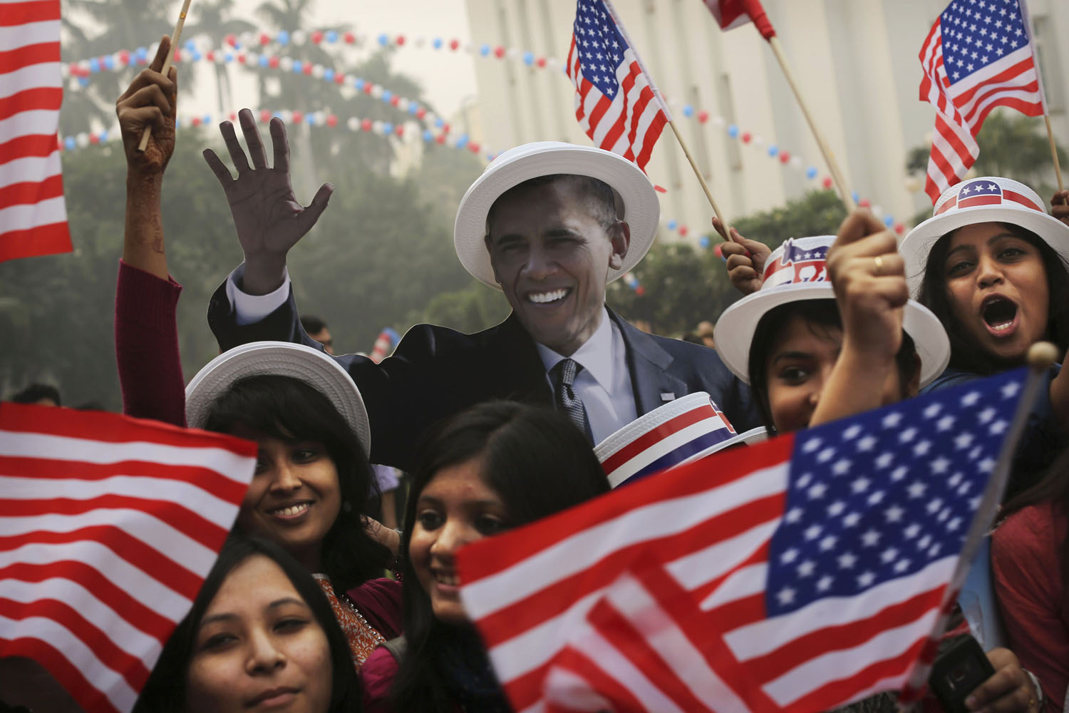Image: Nov. 7, 2012. Indian students next to a cardboard cutout of President Obama after he was projected as the winner during an event organized by the U.S embassy at the landmark Imperial Hotel in New Delhi.