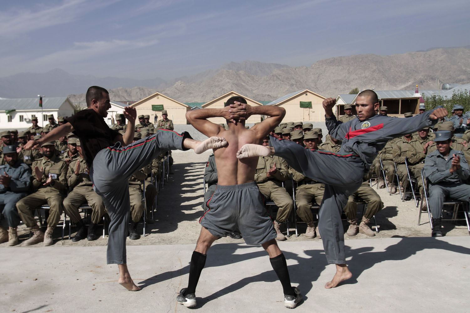 Image: Nov. 7, 2012. Newly graduated Afghan police officers demonstrate their skills during a graduation ceremony at a National Police training center in Laghman province, east of Kabul.