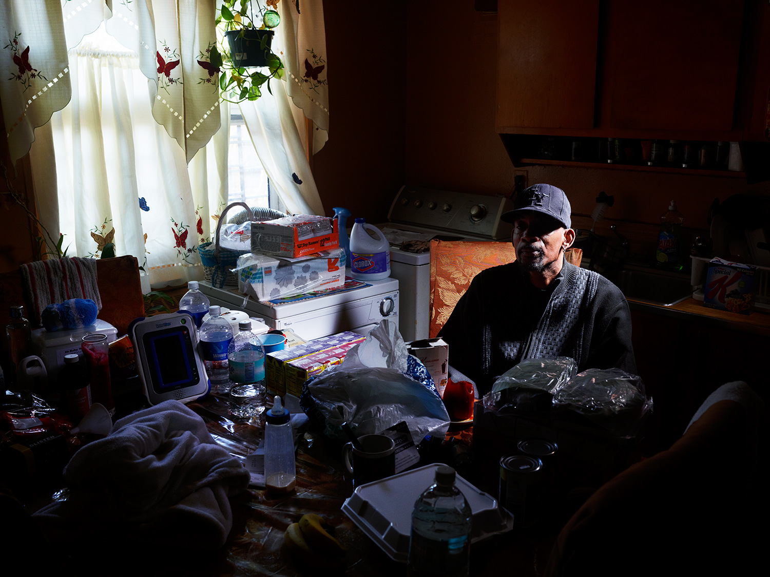 Ervin Pridgen, 52, in his kitchen on the first floor of the Redfern Houses. Pridgen, an ironworker, lives in the apartment with seven other family members. Their only form of transportation, a Buick LaSabre, flooded during the storm, making it hard to visit his wife, who just had surgery.