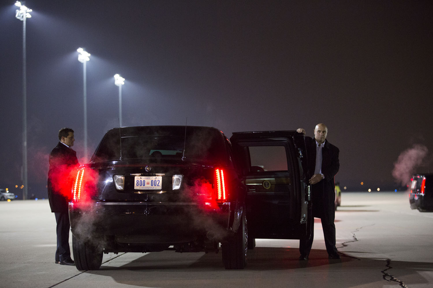 Nov. 5, 2012. Secret Service agents hold the doors to Obama's limousine as he arrives in Des Moines, Iowa.