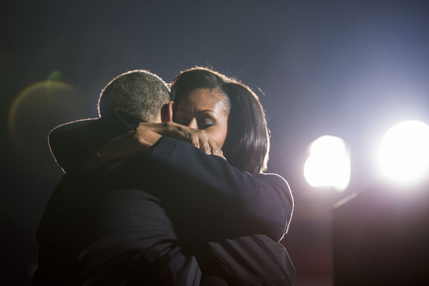 Image: Nov. 5, 2012. Obama hugs the first lady at a campaign rally in Des Moines, Iowa.