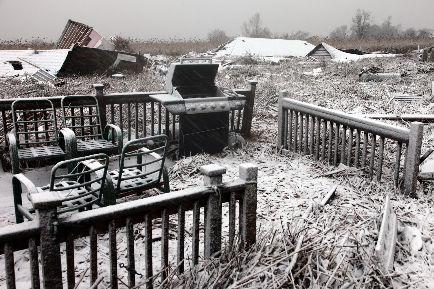 Image: Nor’Easter snow settles on decks and roofs carried by flood water and wind from Kissam Avenue to the marsh along Mill Road during Superstorm Sandy.