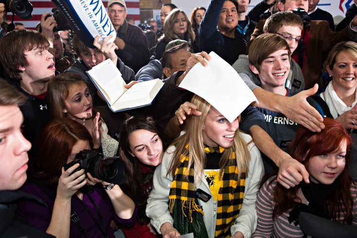 Image: Young Romney supporters swarm to meet him for autographs at a campaign stop in Clive, Iowa. Jan. 2, 2012.