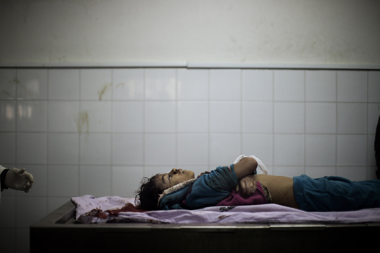 Nov. 20, 2012. The body of Tasneem al-Nahal, 13, lies in the morgue of the al-Shifa hospital in Gaza City after she was killed by an Israeli airstrike in Shati refugee camp two days previous.