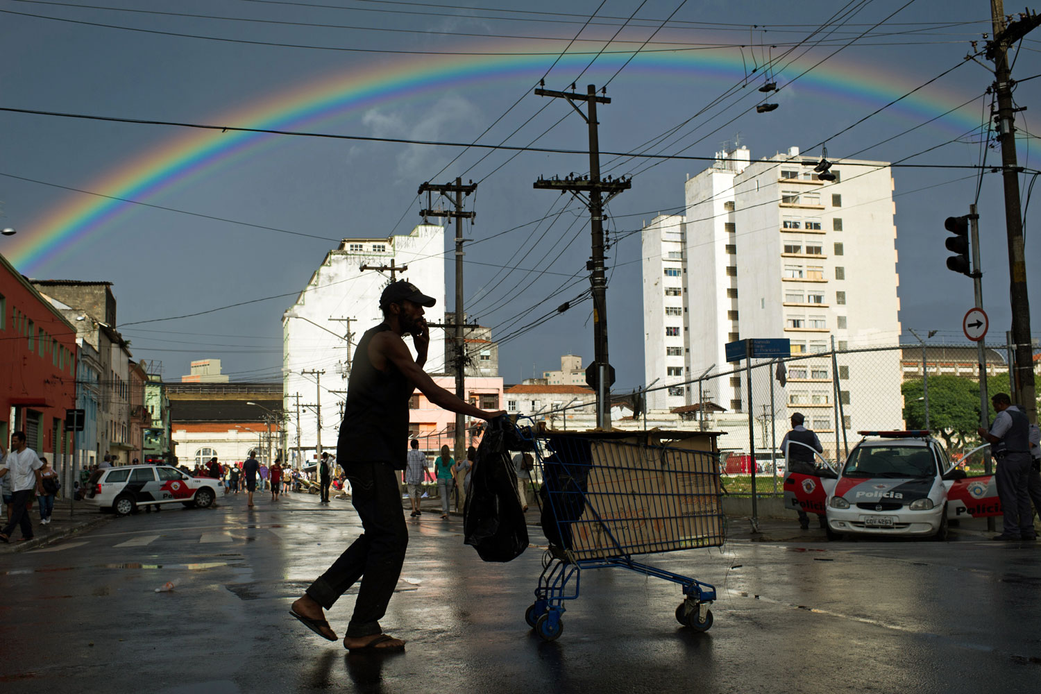 Help for the Powerless
                              Jan. 14, 2012. A homeless man pushes a cart as a rainbow arcs acoss the sky in an area called  Cracolandia  (Crackland in English), in downtown Sao Paulo, Brazil.