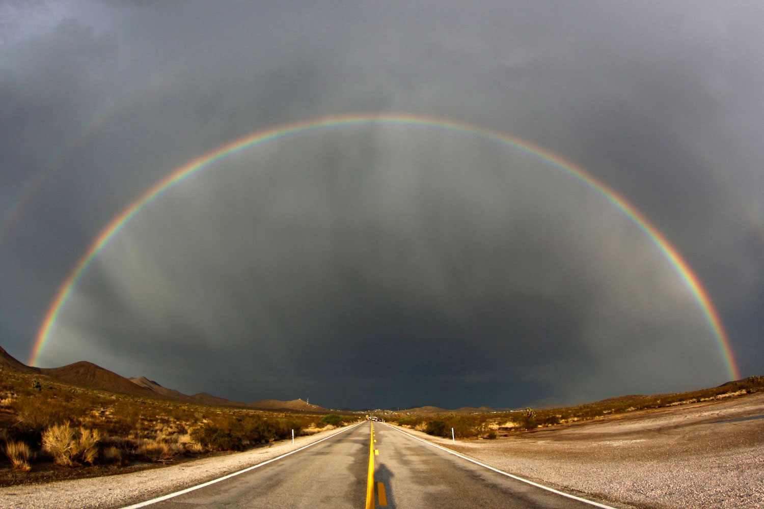 Darkness and Light
                              July 13, 2012. A double rainbow appears after a heavy storm near Searchlight, Nevada.