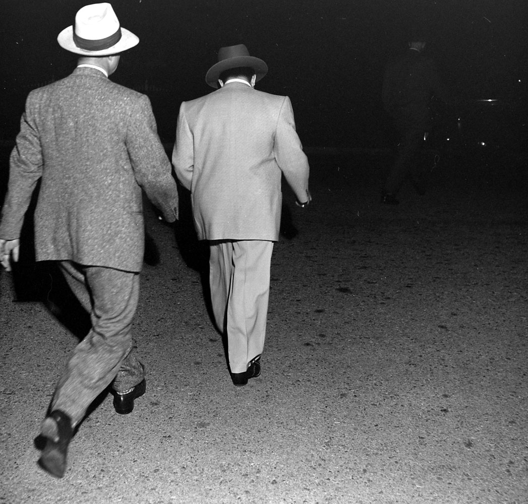 Mickey Cohen hauled in by the cops, Los Angeles, 1949.