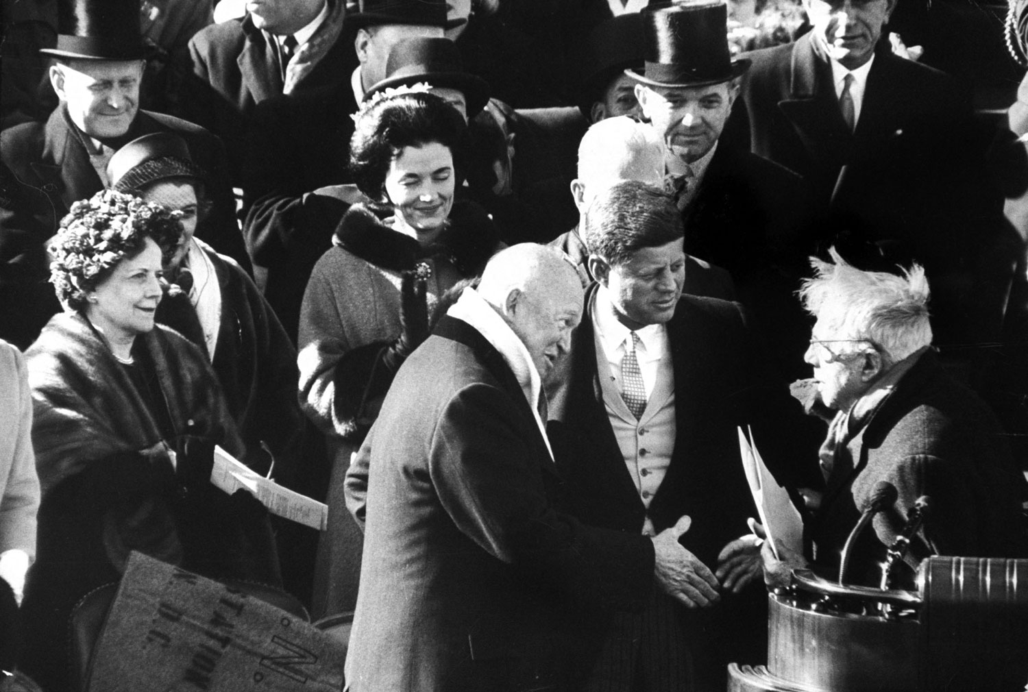 Dwight Eisenhower shakes hands with poet Robert Frost after Frost recited one of his poems from memory at the inauguration of President John F. Kennedy in 1961. (The glare of sunlight on his papers made it impossible for him to read a poem he had written expressly for the event.)
