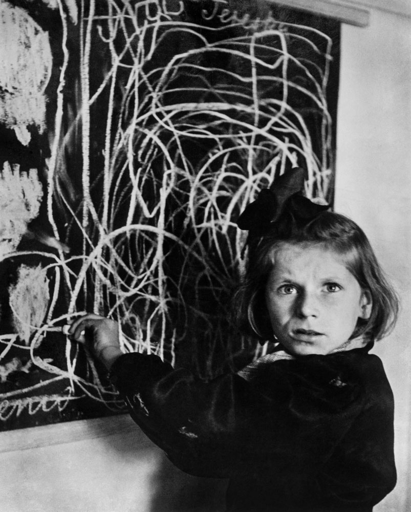 POLAND. 1948. Teresa, a child in a residence for disturbed children, grew up in a concentration camp. She drew a picture of 'home' on the blackboard.