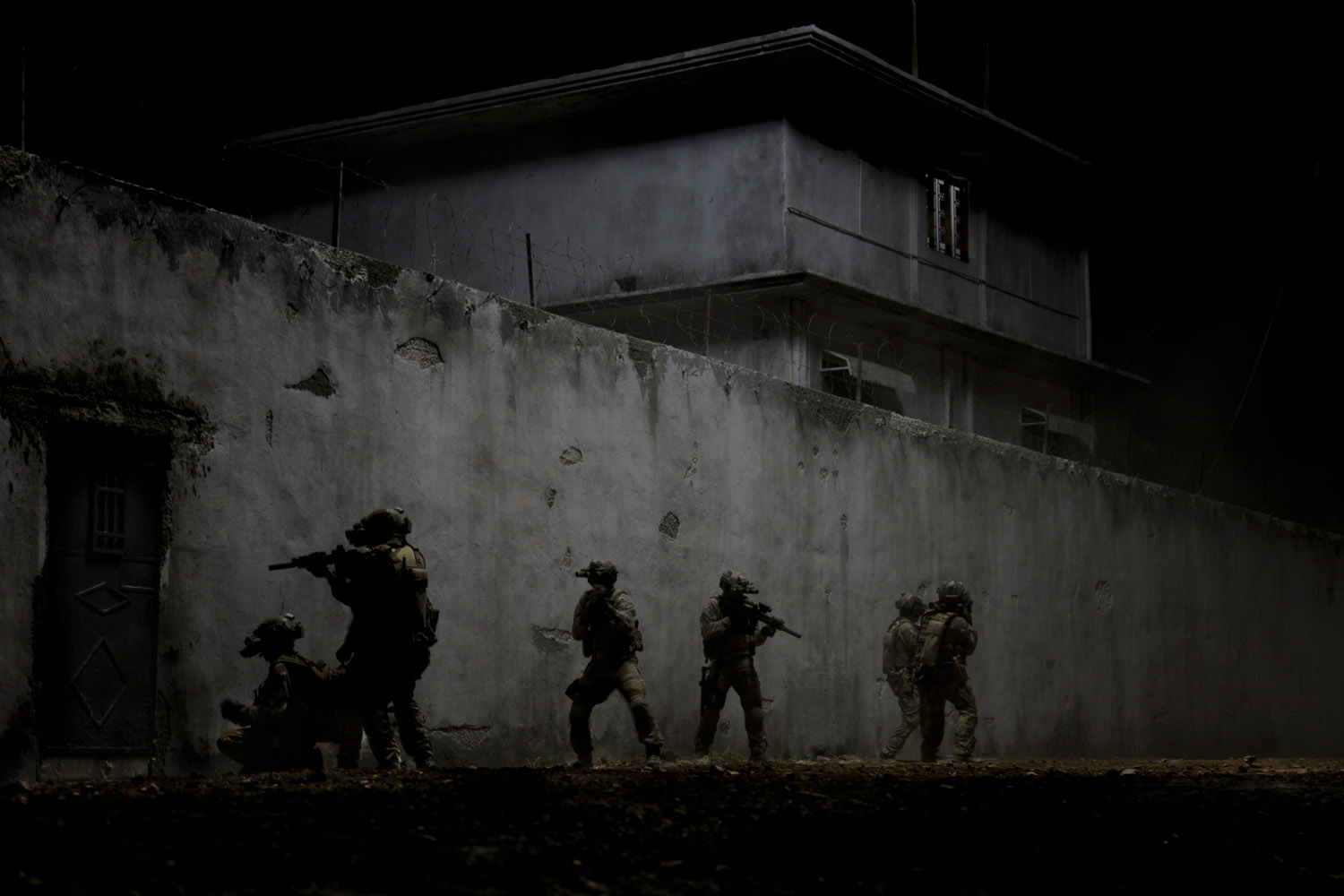Navy SEALs raid Osama Bin Laden's compound in Zero Dark Thirty.