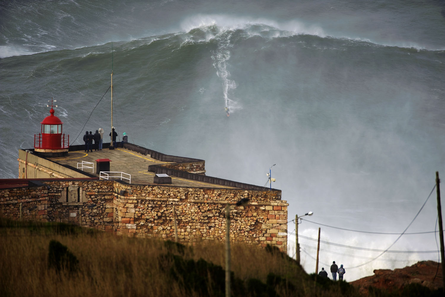 Jan. 28, 2013. U.S. surfer Garrett McNamara rides a wave off Praia do Norte beach in Nazare, Portugal. McNamara is said to have broken his own world record for the largest wave surfed when he caught this wave reported to be around 100ft, off the coast of Nazare. If the claims are verified, it will mean that McNamara, who was born in Pittsfield, Massachusetts but whose family moved to Hawaii's North Shore when he was aged 11, has beaten his previous record, which was also set at Nazare, of 23.77 meters (78 feet) in November 2011. (To Mane—Barcroft Media/Landov)