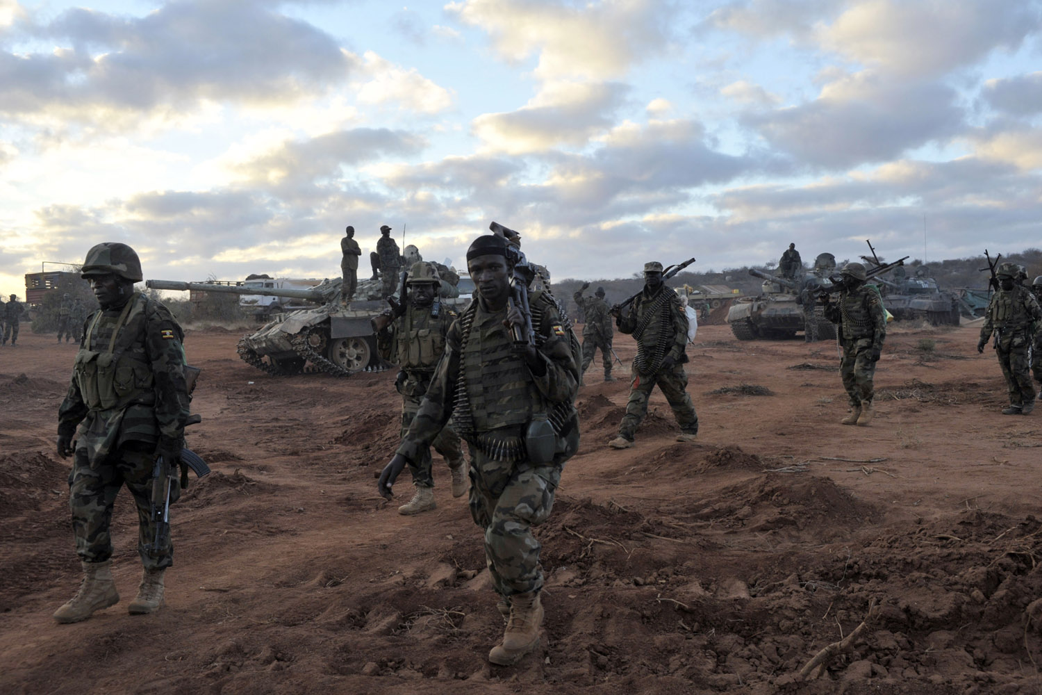 Feb. 23, 2013. Ugandan soldiers, operating under the African Union Mission in Somalia (AMISOM), advance towards Burhkaba from their former position in the town of Leego, Somalia alongside members of the Somali National Army (SNA).