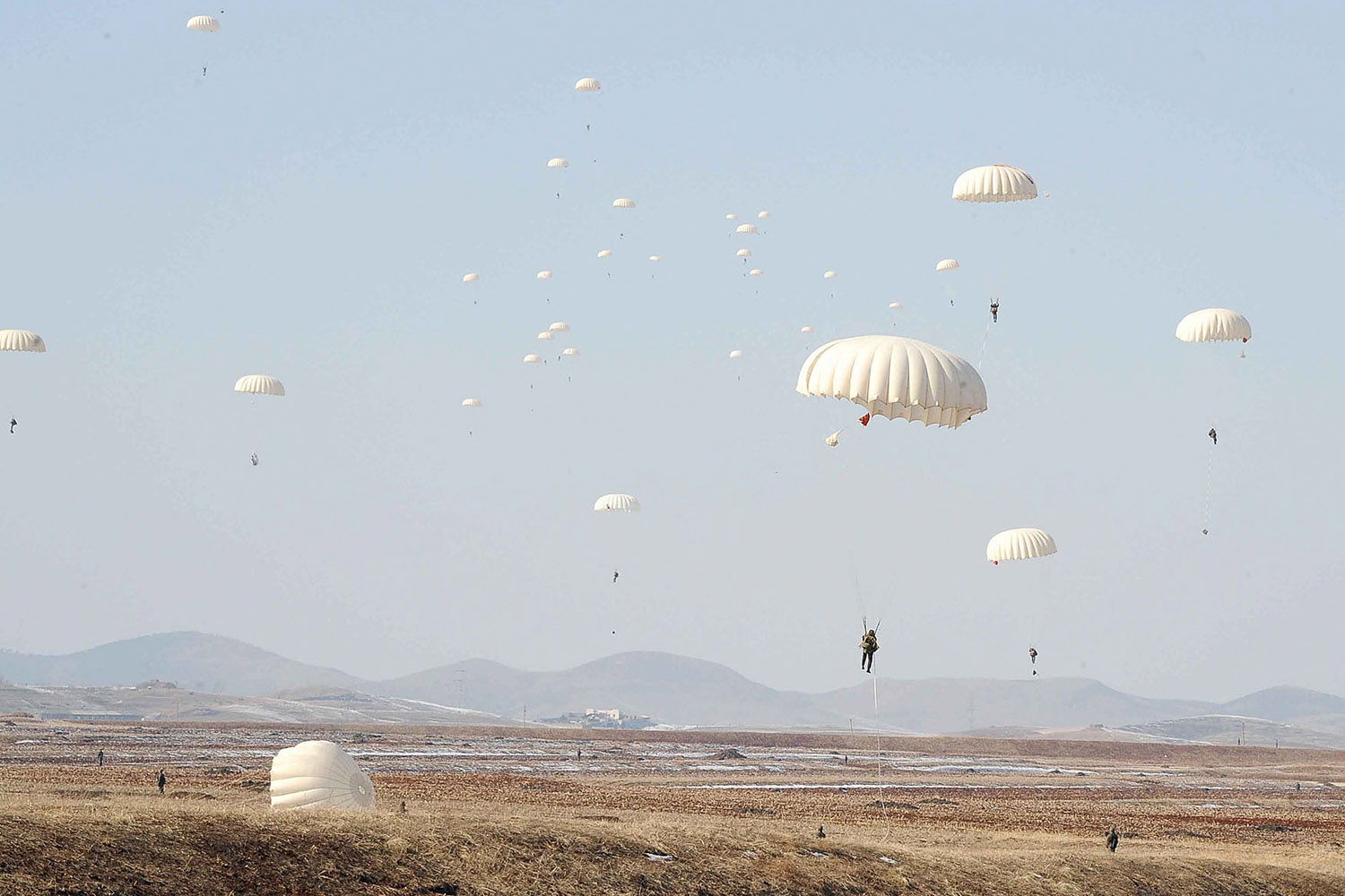 Feb. 23, 2013.  North Korean paratroopers drop from the sky during a flight exercise and a para-trooping drill in North Korea.