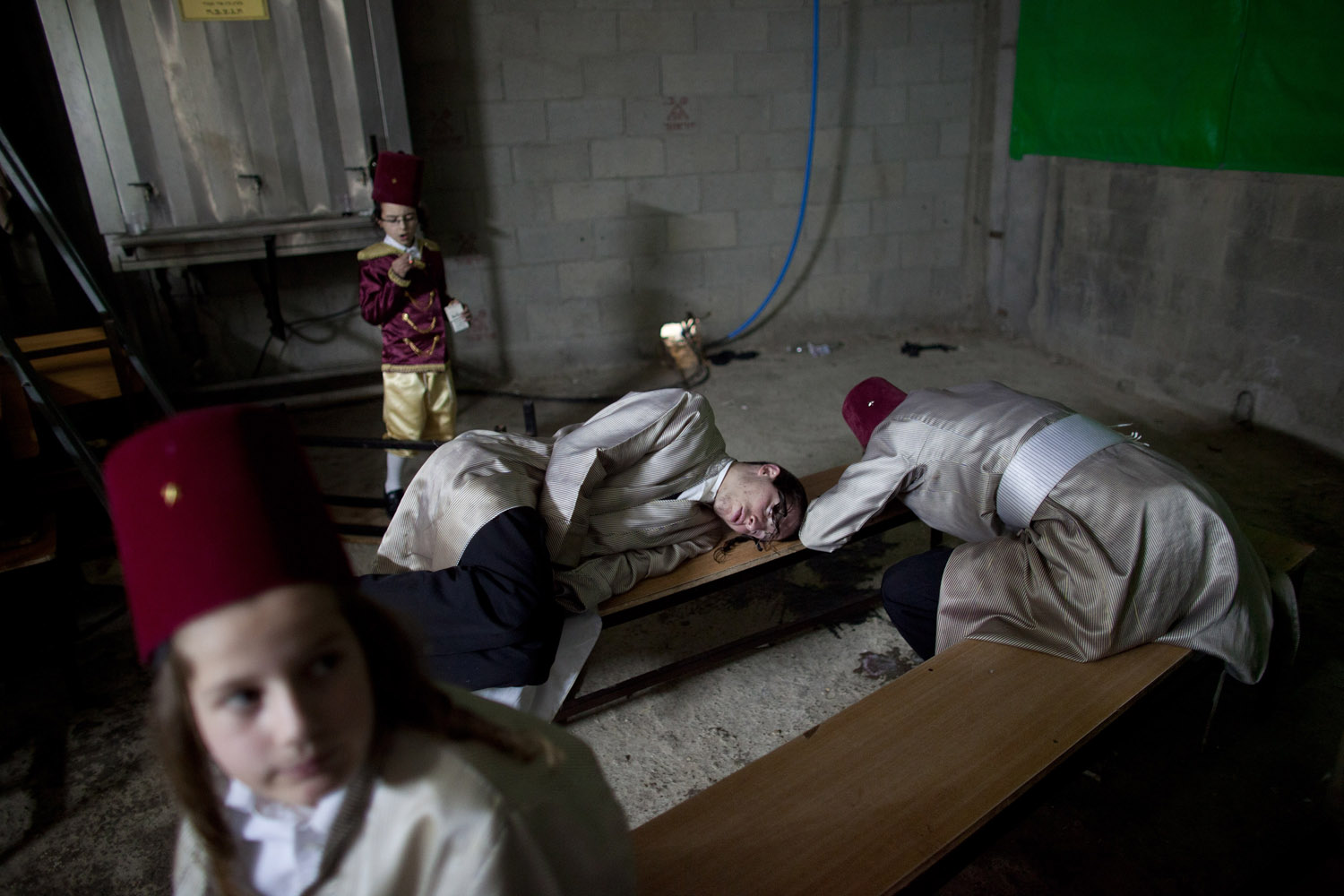 Feb. 24, 2013. Ultra-Orthodox Jews from the Lelov Hasidic sect rest as they celebrate the Jewish festival of Purim.