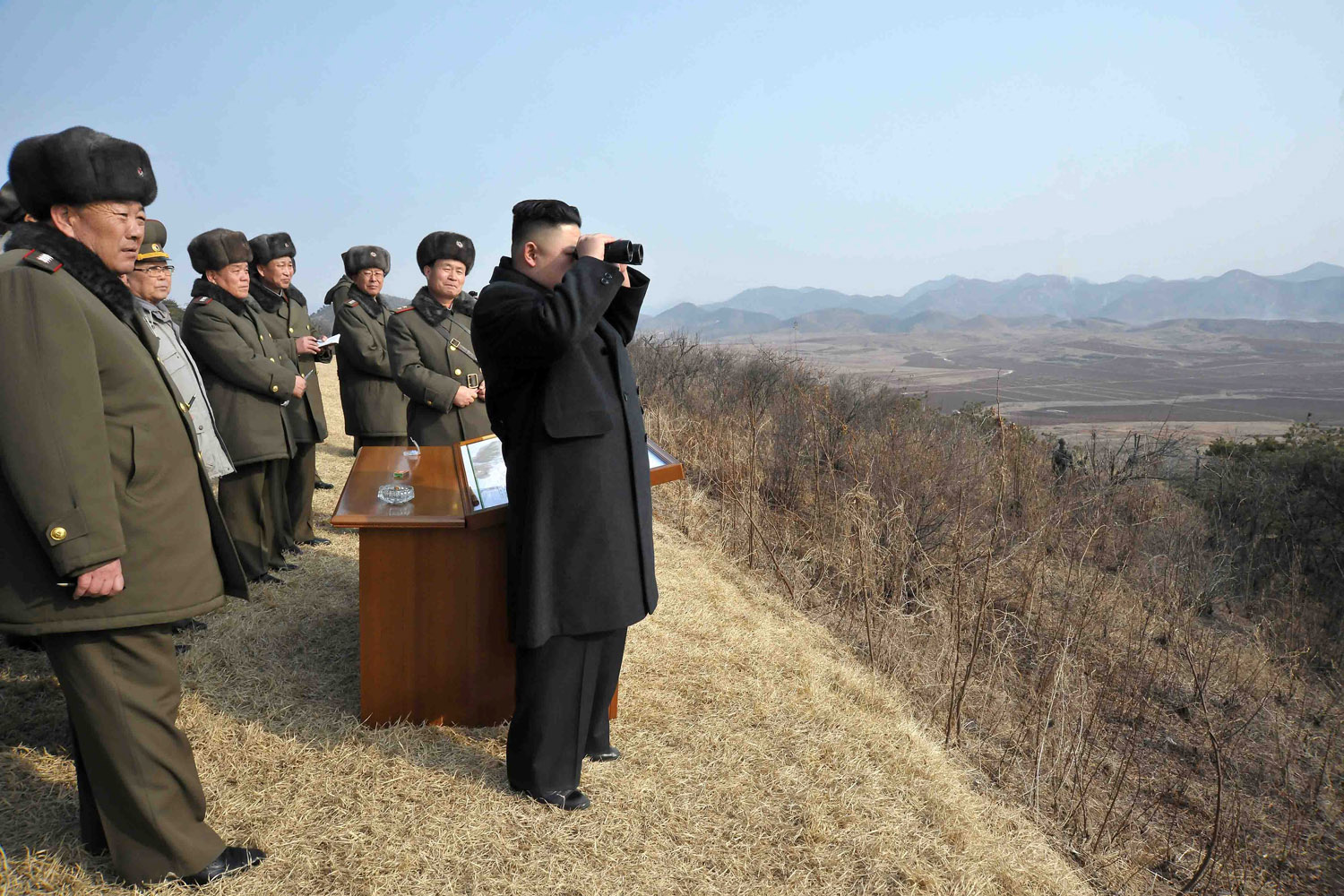 Feb. 26, 2013. North Korean leader Kim Jong-un looking at targets through binoculars during an inspection of an artillery firing exercise.