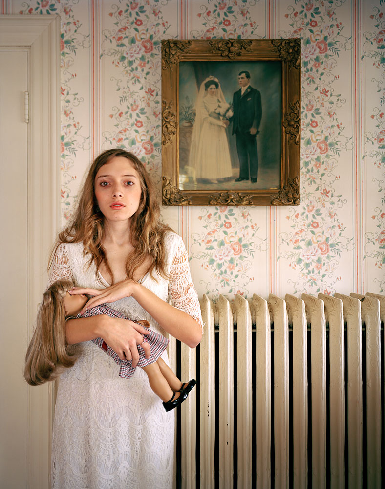 3rd Prize People – Observed Portraits Single. Ilona Szwarc, Poland. 19 February 2012, Boston, Massachusetts, USA. “American Girl” is a popular line of dolls that can be customized to look exactly like their owners. Kayla poses with her lookalike doll in front of a portrait of her ancestors.