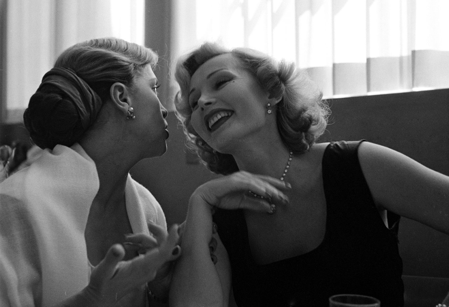 Zsa Zsa Gabor at lunch with French actress Denise Darcel, California, 1951.
