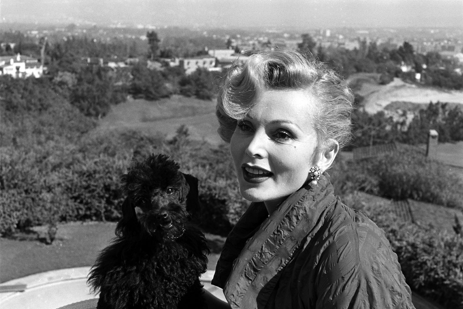 Zsa Zsa Gabor with her dog, Farouk, California, 1951.
