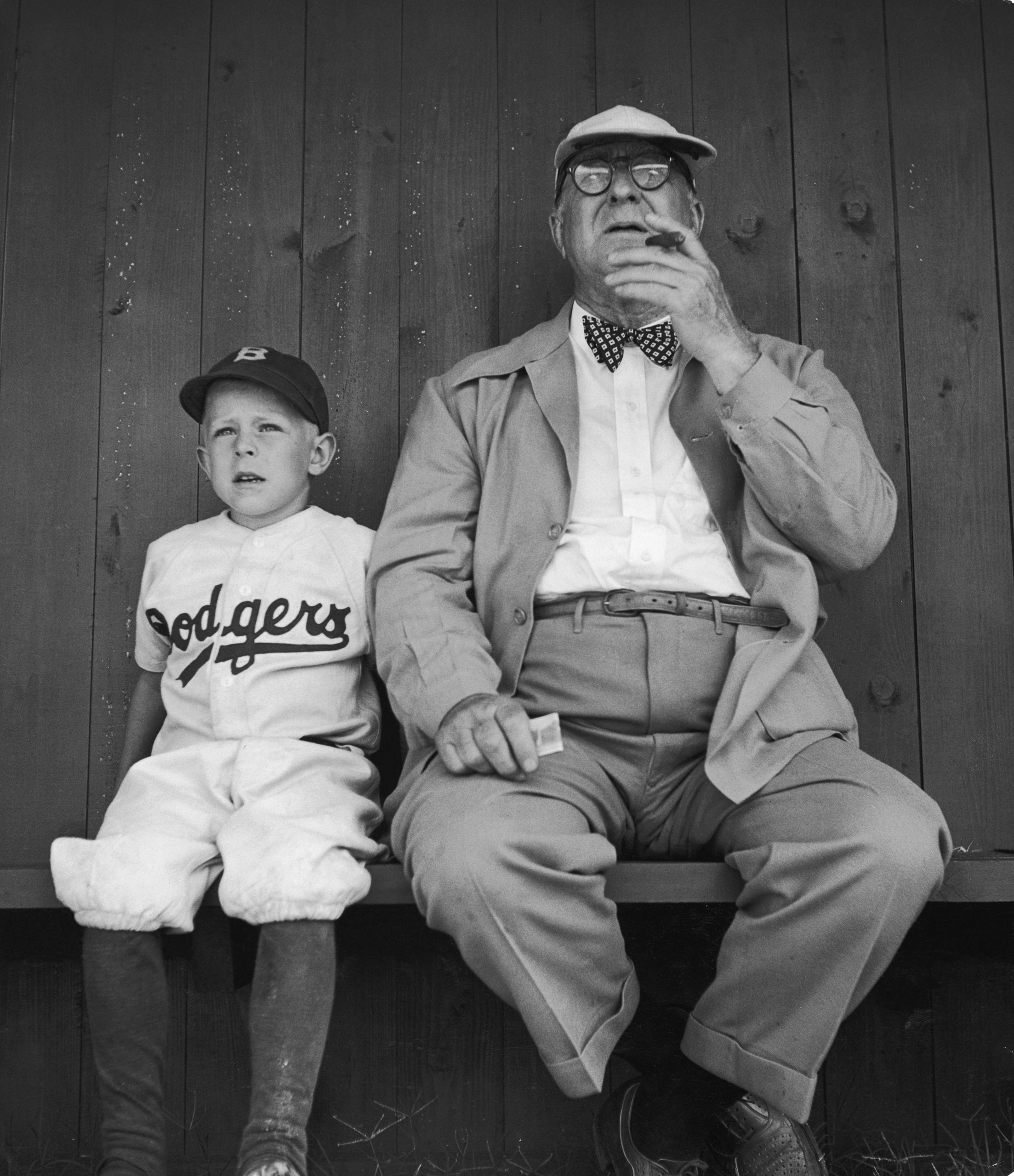 Branch Rickey watches practice with his grandson during spring training at Dodgertown, Vero Beach, Fla., 1948.