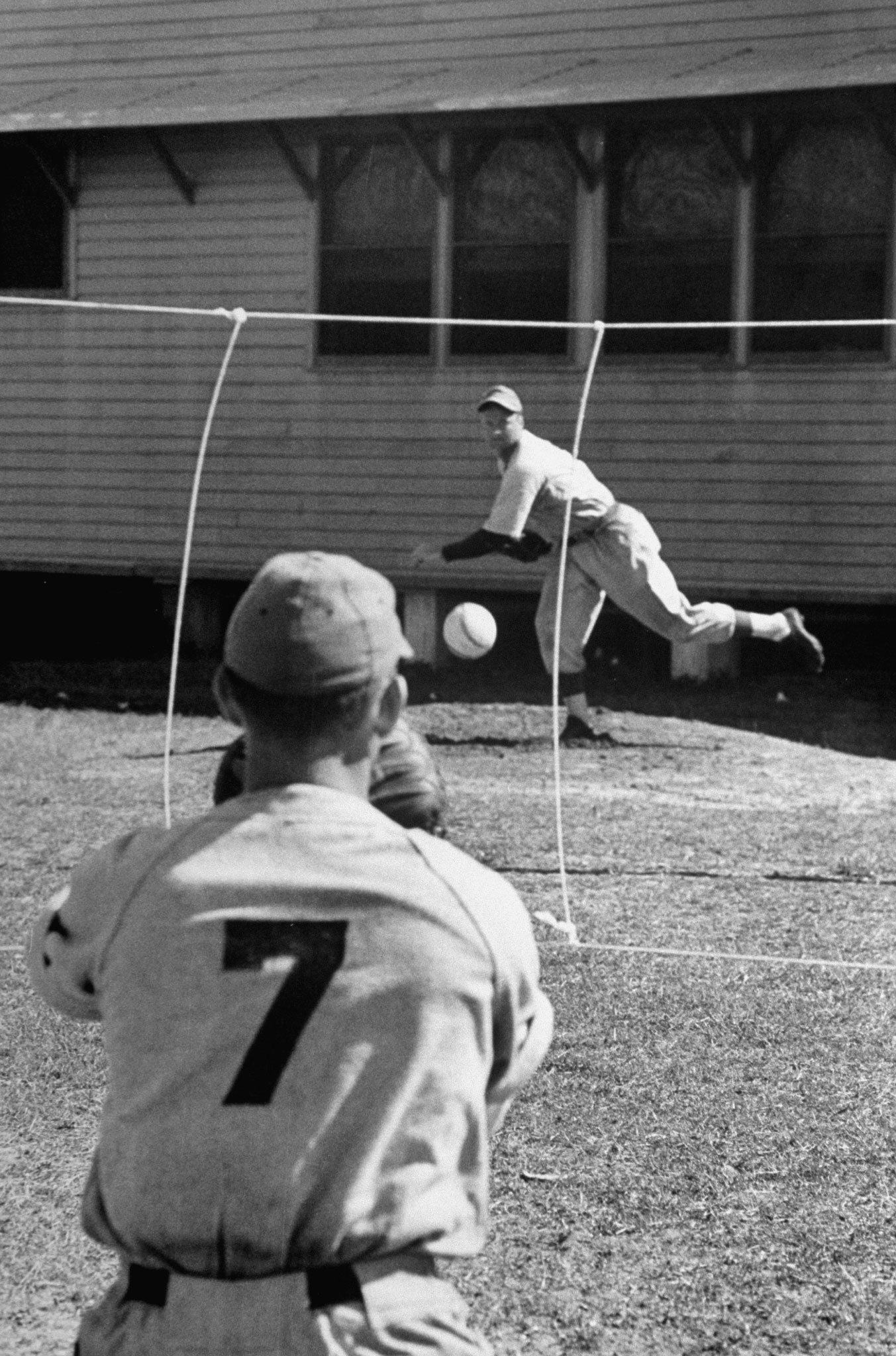 With strings marking the strike zone, a pitcher practices during spring training at Dodgertown, Vero Beach, Fla., 1948.