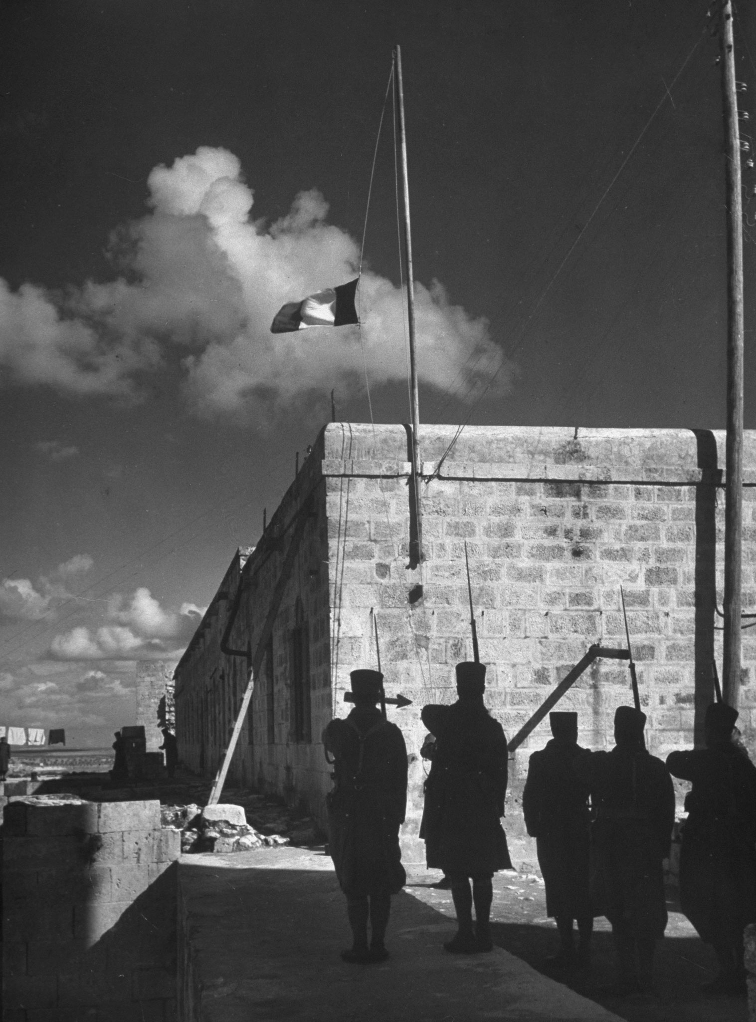 Raising the French flag at Aleppo, Syria, 1940.