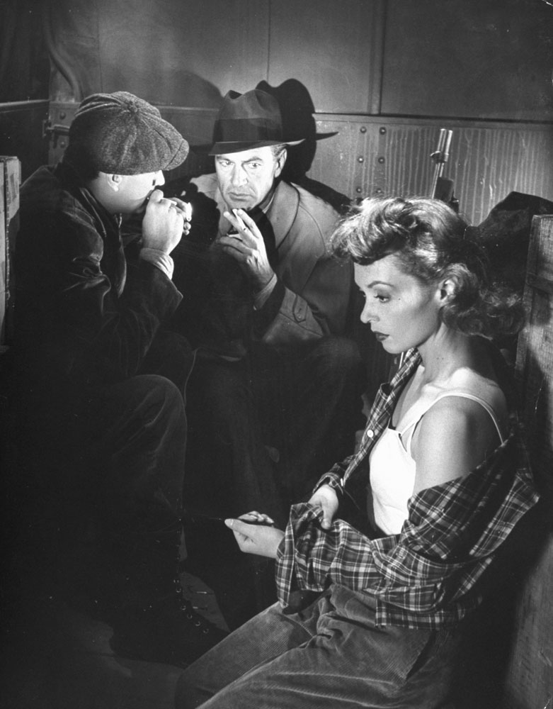 Gary Cooper (center) and Lilli Palmer with an unidentified actor (possibly Robert Alda) in a scene from Fritz Lang's Cloak and Dagger, 1946.