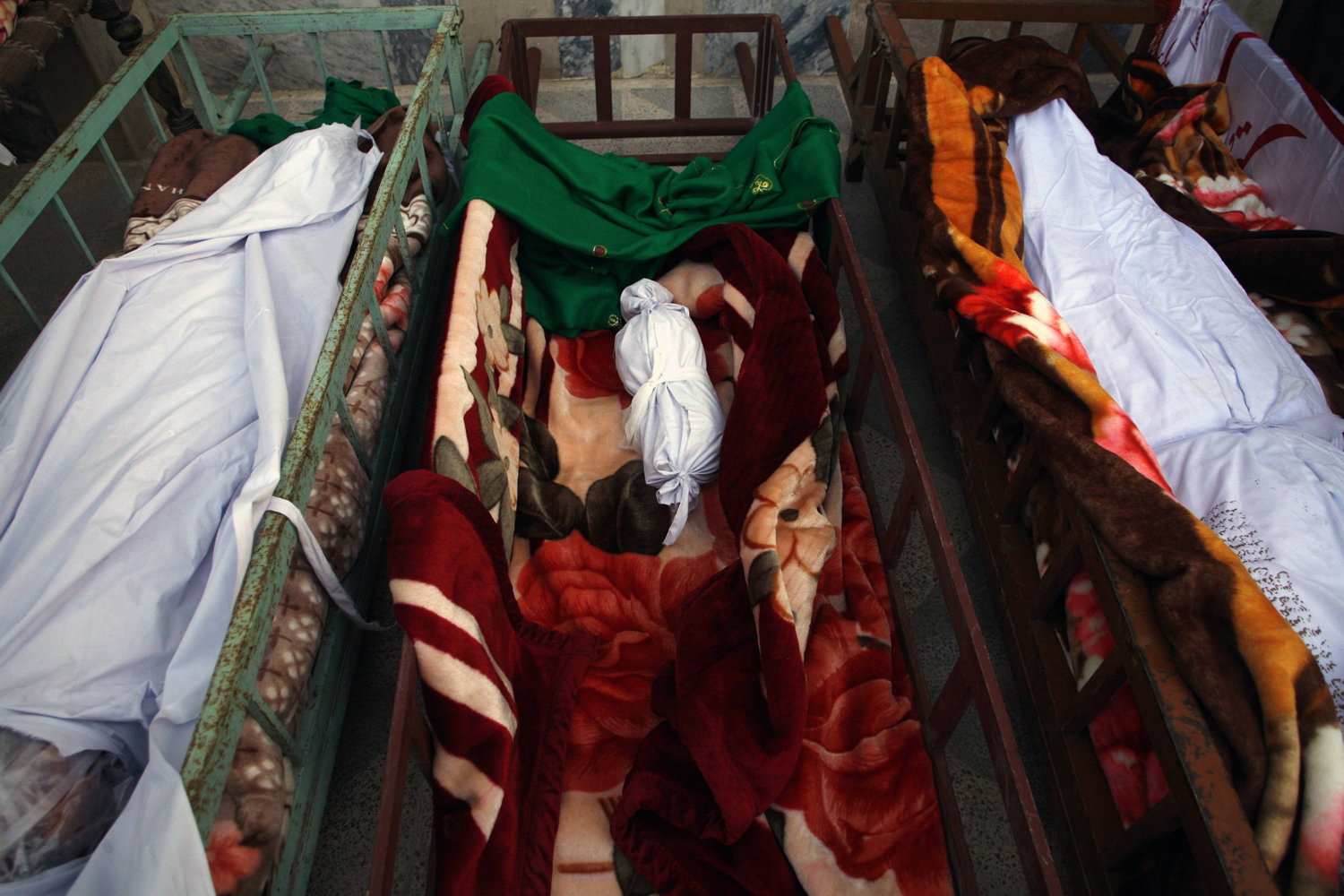 The body of a baby who was killed in Saturday's bomb attack in a Shi'ite Muslim area, lies in a coffin at a mosque during a funeral ceremony in the Pakistani city of Quetta