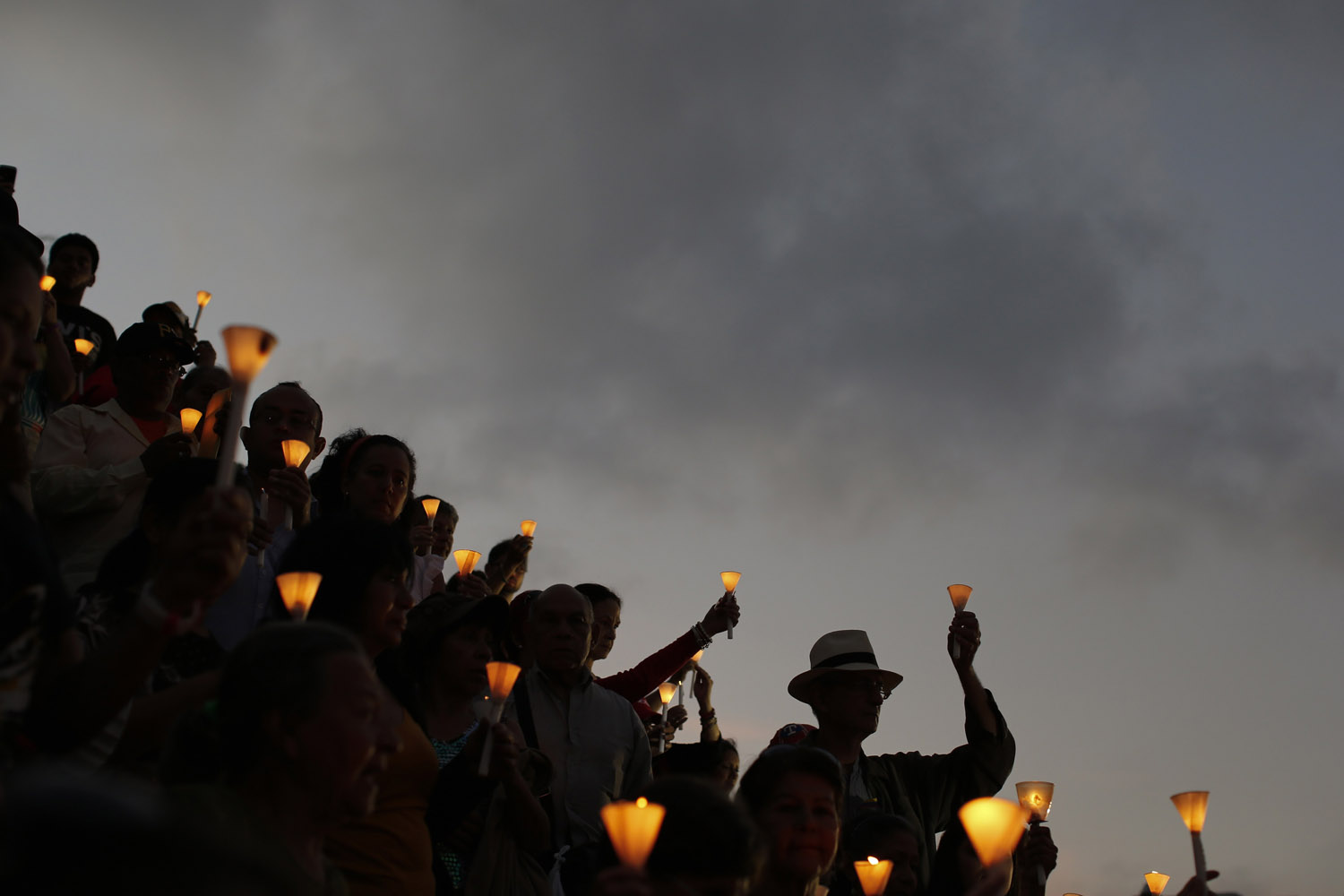 Feb. 22, 2013. People hold candles during a praying ceremony for the health of Venezuelan President Hugo Chavez, in Caracas, Venezuela.