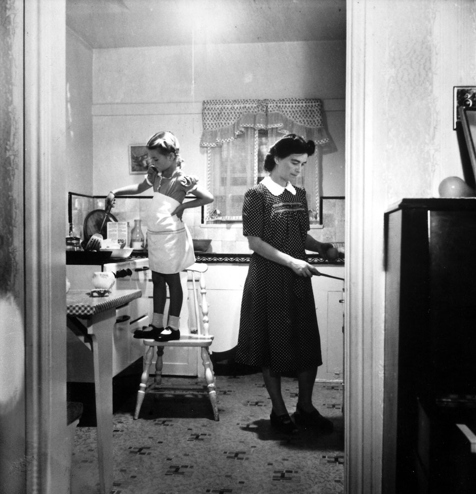 Natalie Wood in the kitchen with her mother, Mrs. Nick Gurdin, 1945.
