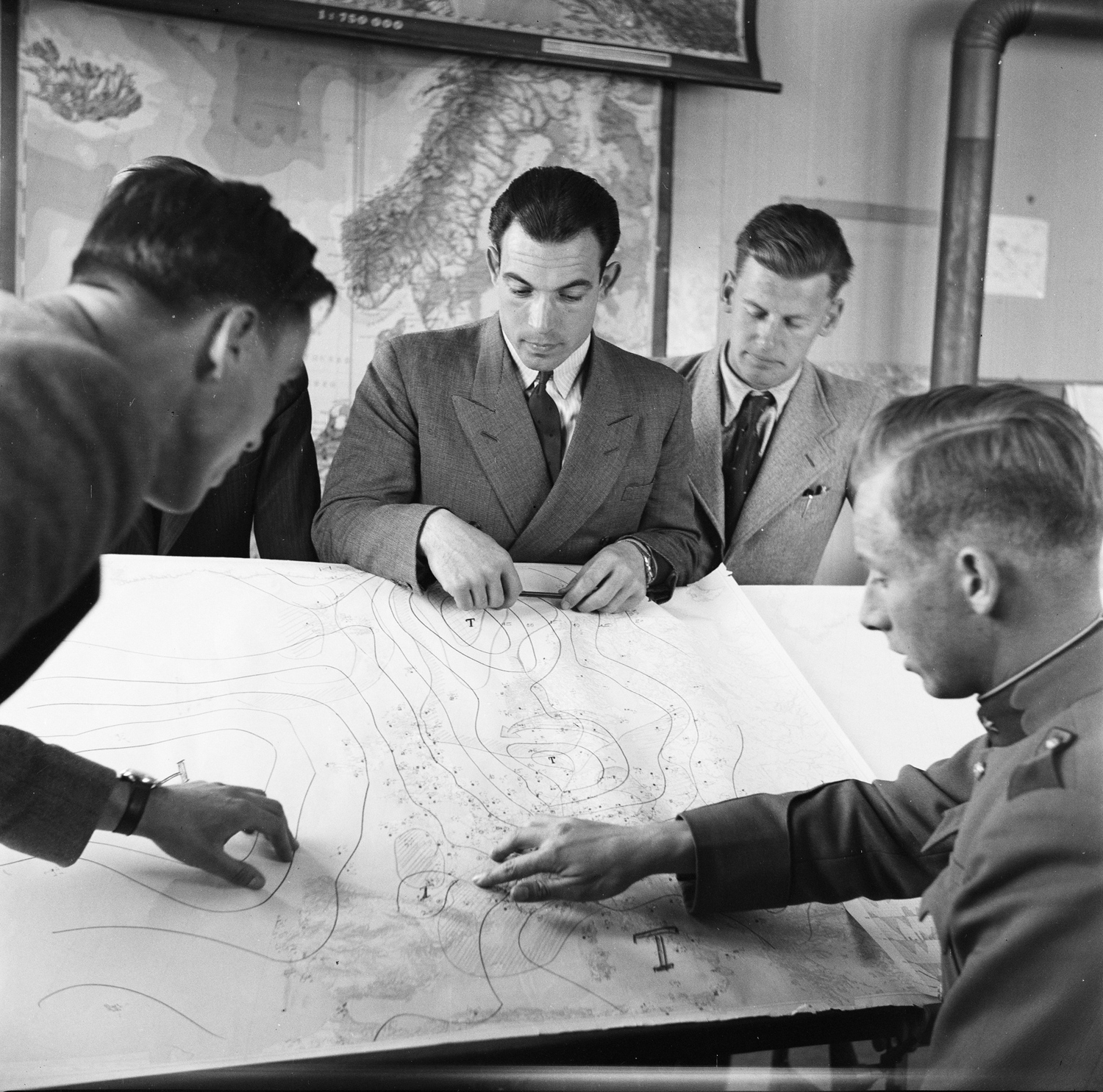 Studying the weather map in a general aviation pilot course, 1943.
