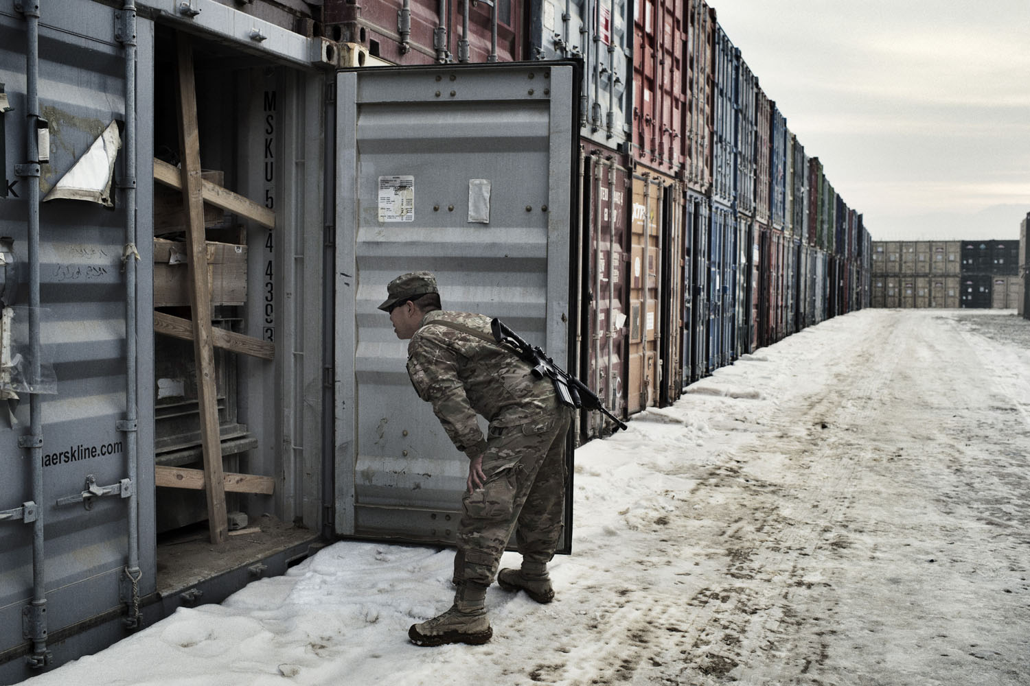 Bagram Afghanistan January 28 2013 Frst Lieut. Henry Chan of the 18th Combat Sustainment Support Battalion opens containers to find out what is inside at a container yard on Bagram Airbase in Afghanistan. With most U.S. forces set to depart Afghanistan by the end of 2014, retrograde, the military’s term for the removal of combat equipment from the country, has become a top mission.