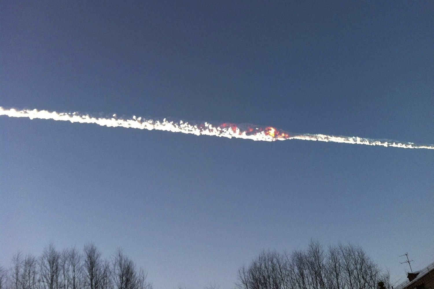 Trail of a falling object is seen above the Urals city of Chelyabinsk