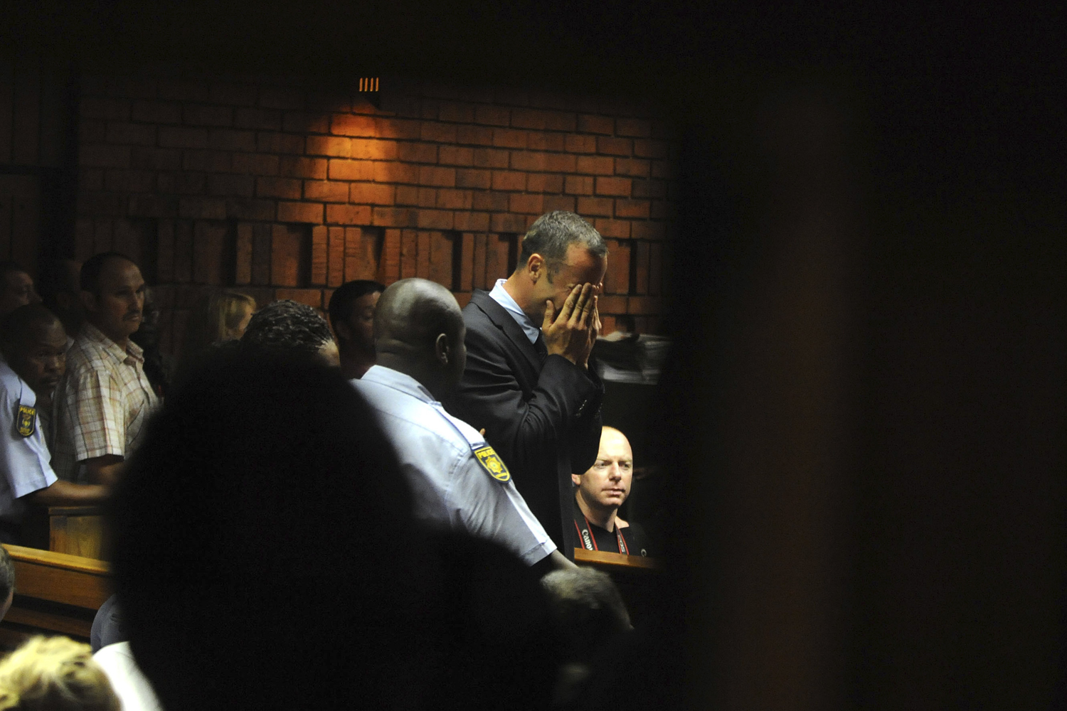 South African 'Blade Runner' Oscar Pistorius breaks down during his court appearance in Pretoria