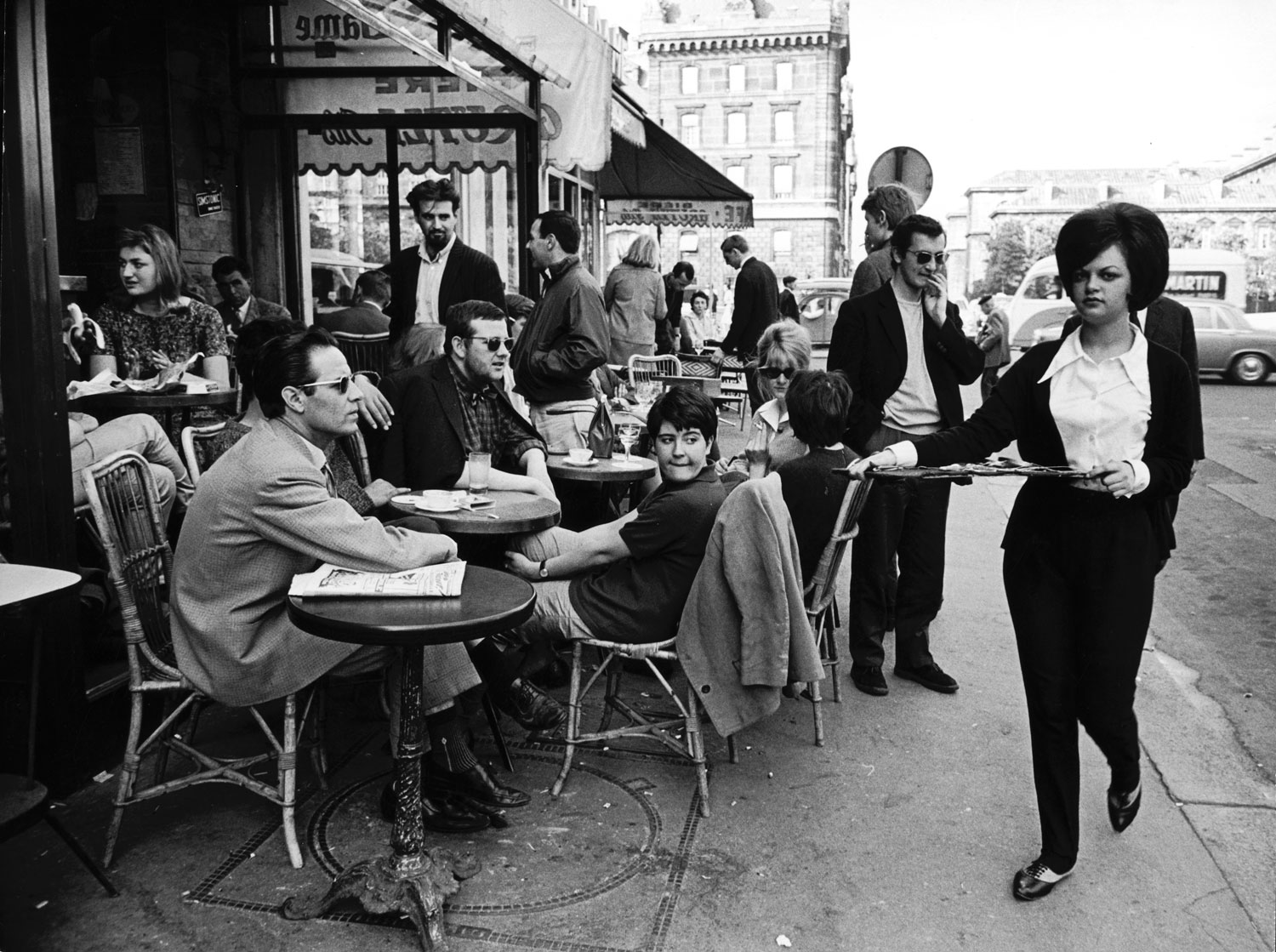 Parisians at a sidewalk cafe, 1963.