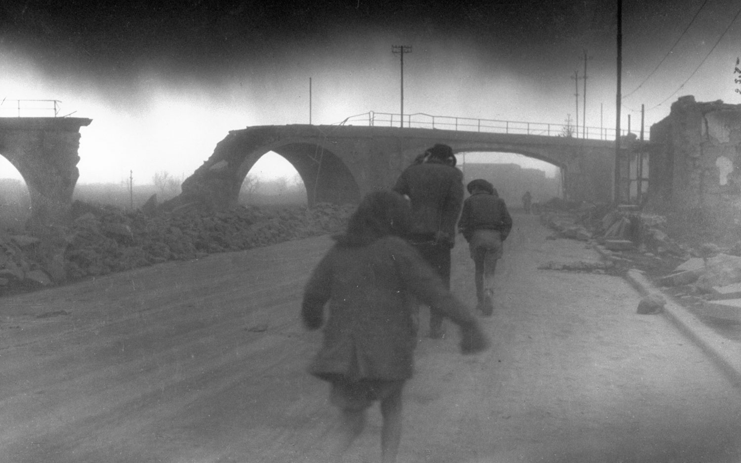 Refugees make their way through dust during the 1944 eruption of Mt. Vesuvius, Italy.