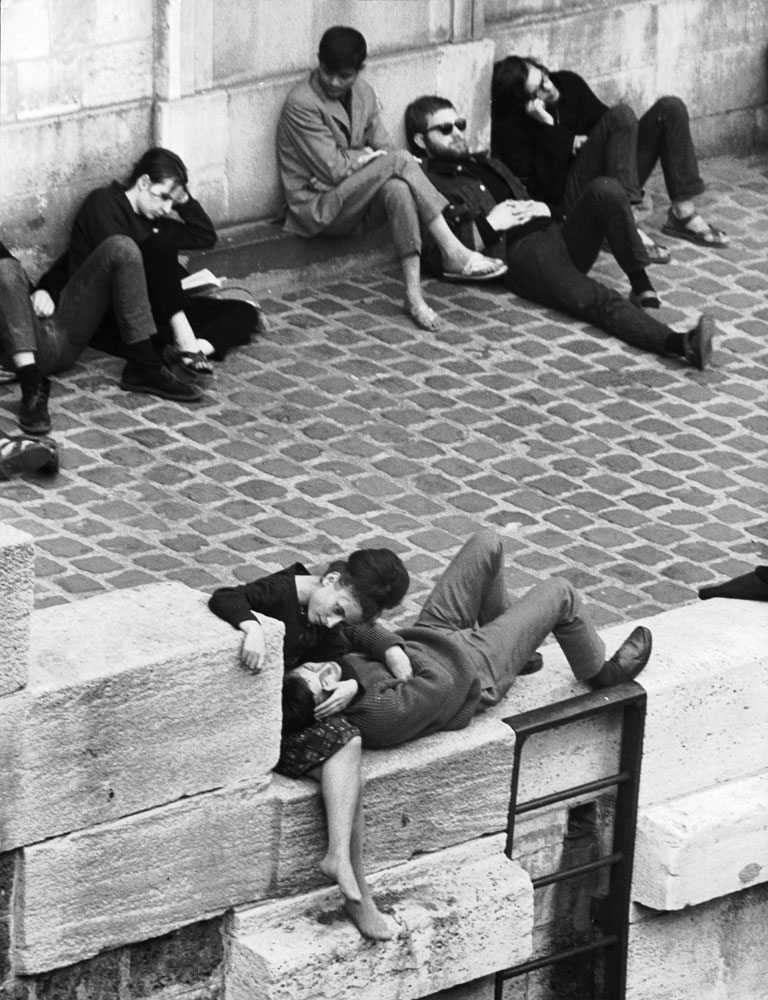 Parisian beatniks hang out on bank of the Seine, 1963.