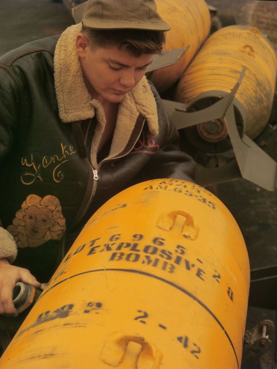 Loading bombs on an American bomber during World War II, England, 1942.