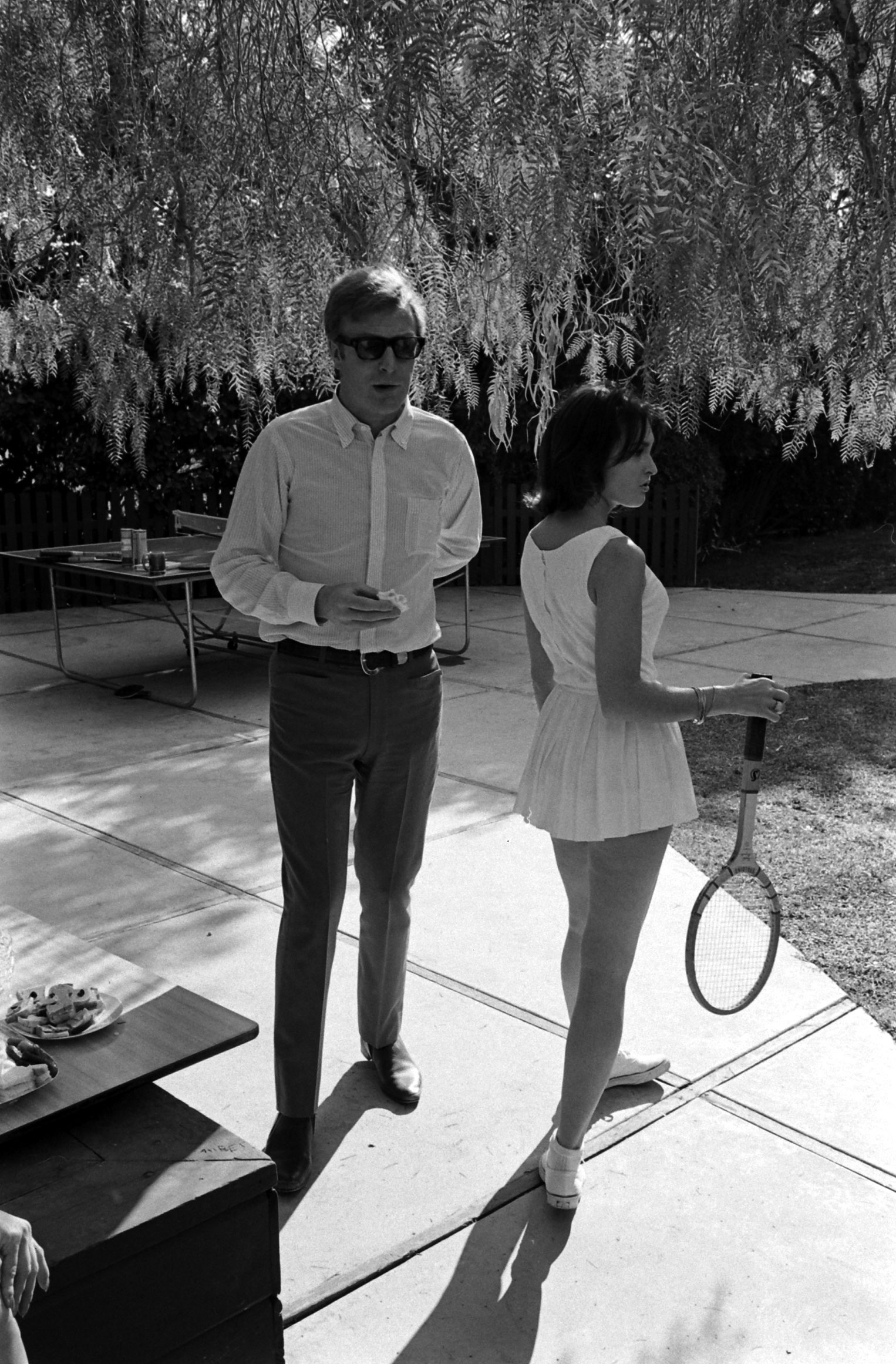 Michael Caine with an unidentified woman in Los Angeles in 1966.