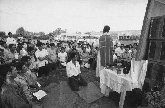 Father Thomas McCullough says mass for Mexican day laborers, Calif., 1959.