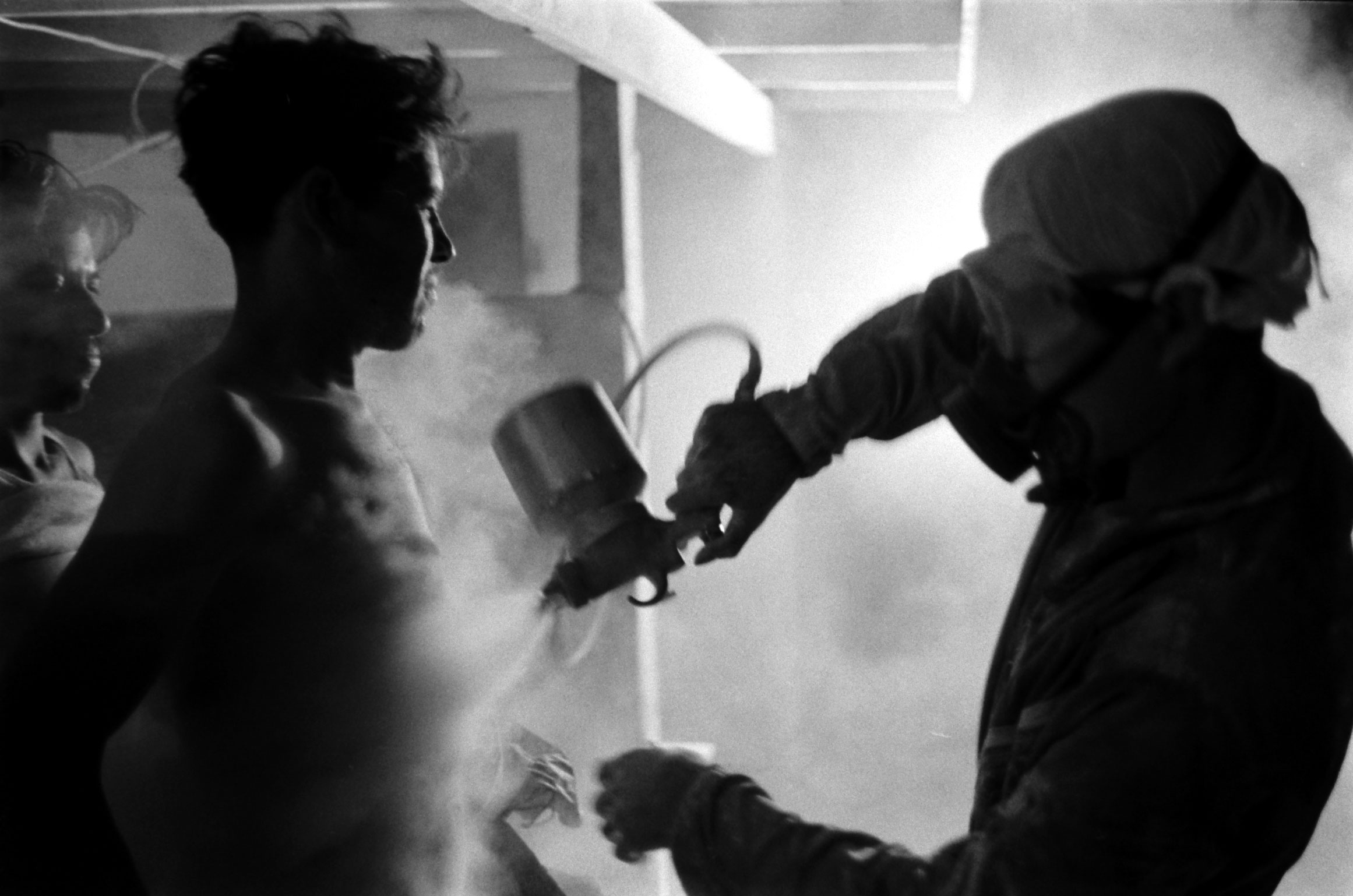 Migrant farm workers sprayed with unidentified chemical after day's work, USA, 1959.