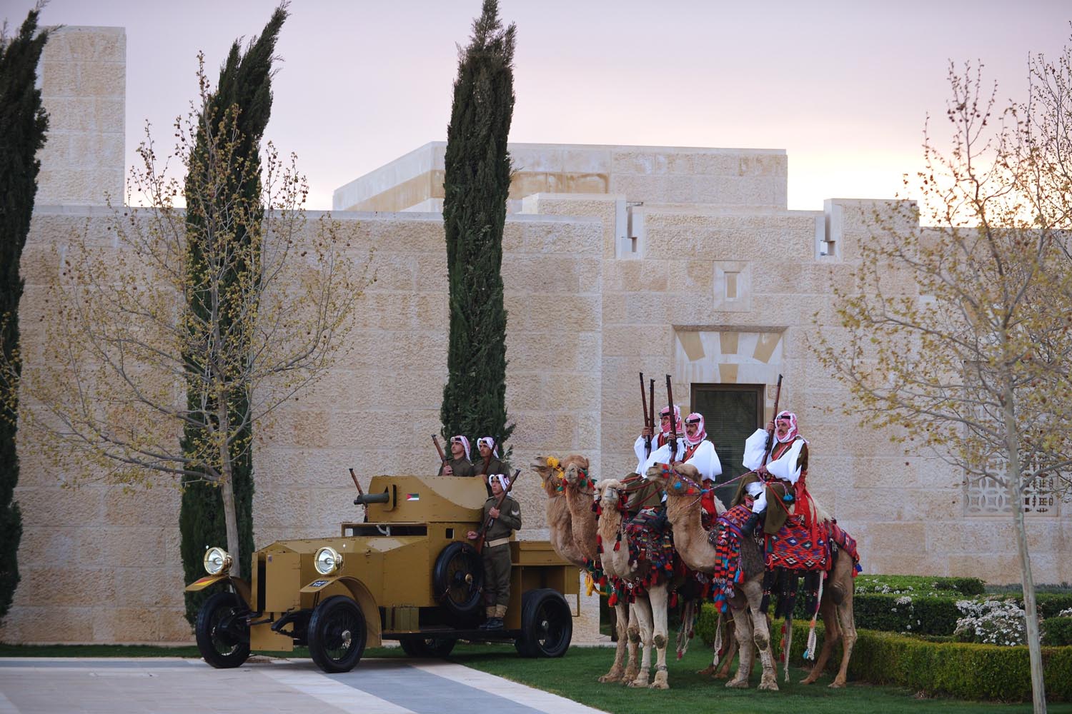 March 22, 2013. Honour guard sit on camels near an antique amoured personnel carrier during a welcome ceremony for the arrival of US President at Al-Hummar Palace in the Jordanian capital Amman.